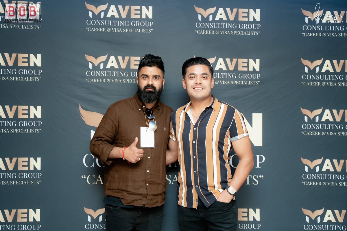 Guests in front of the Maven Consulting Group backdrop at Rock Fest Vol. 1